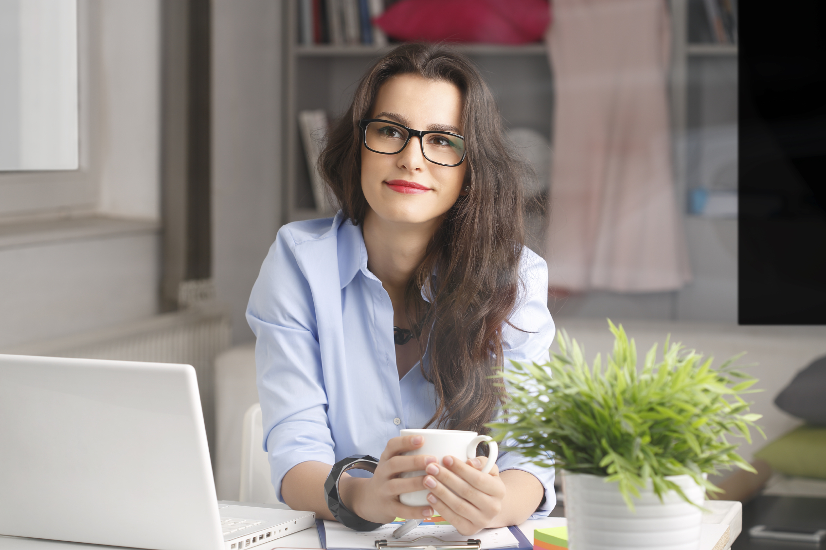Young businesswoman working at home coach1